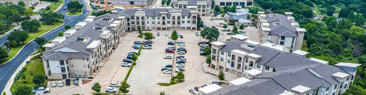 Aerial view of a Central Texas neighborhood and apartment community