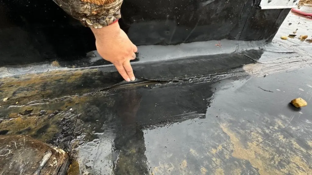 Technician performing commercial roof maintenance