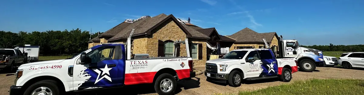 Texas Traditions Roofing trucks at a Central Texas home